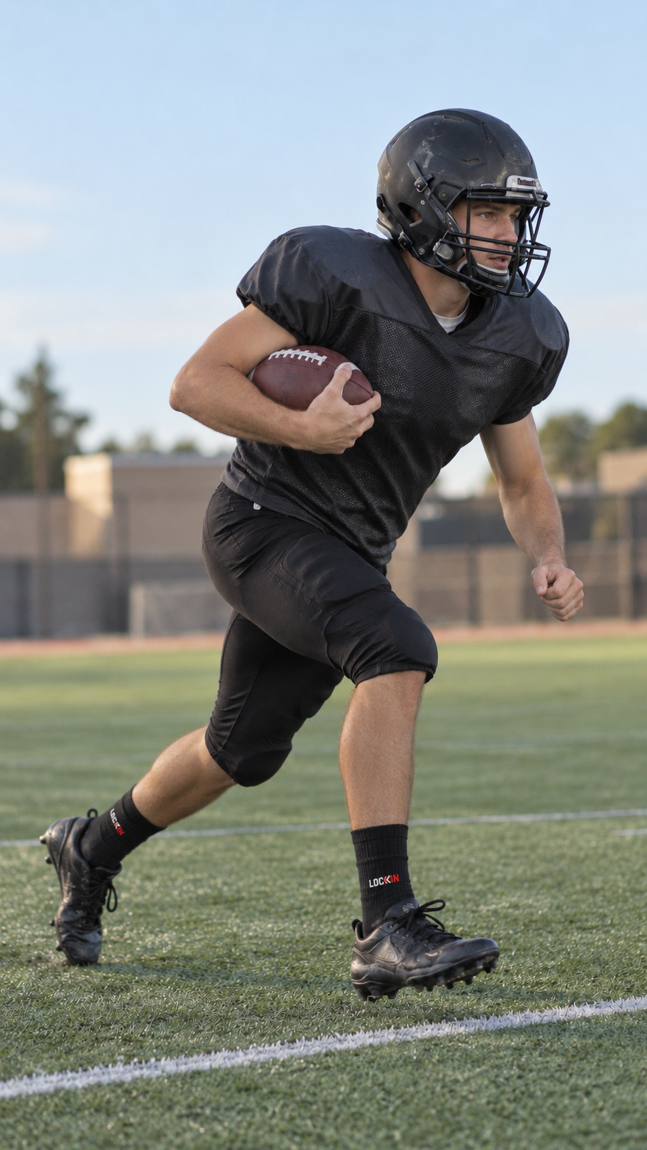 Illustrative adult American football player accelerating across turf in black crew socks and cleats